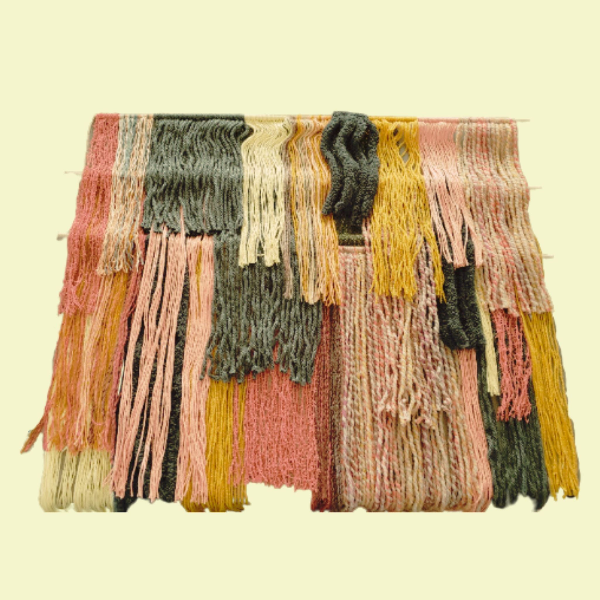 pastel tiered yarn wall hanging