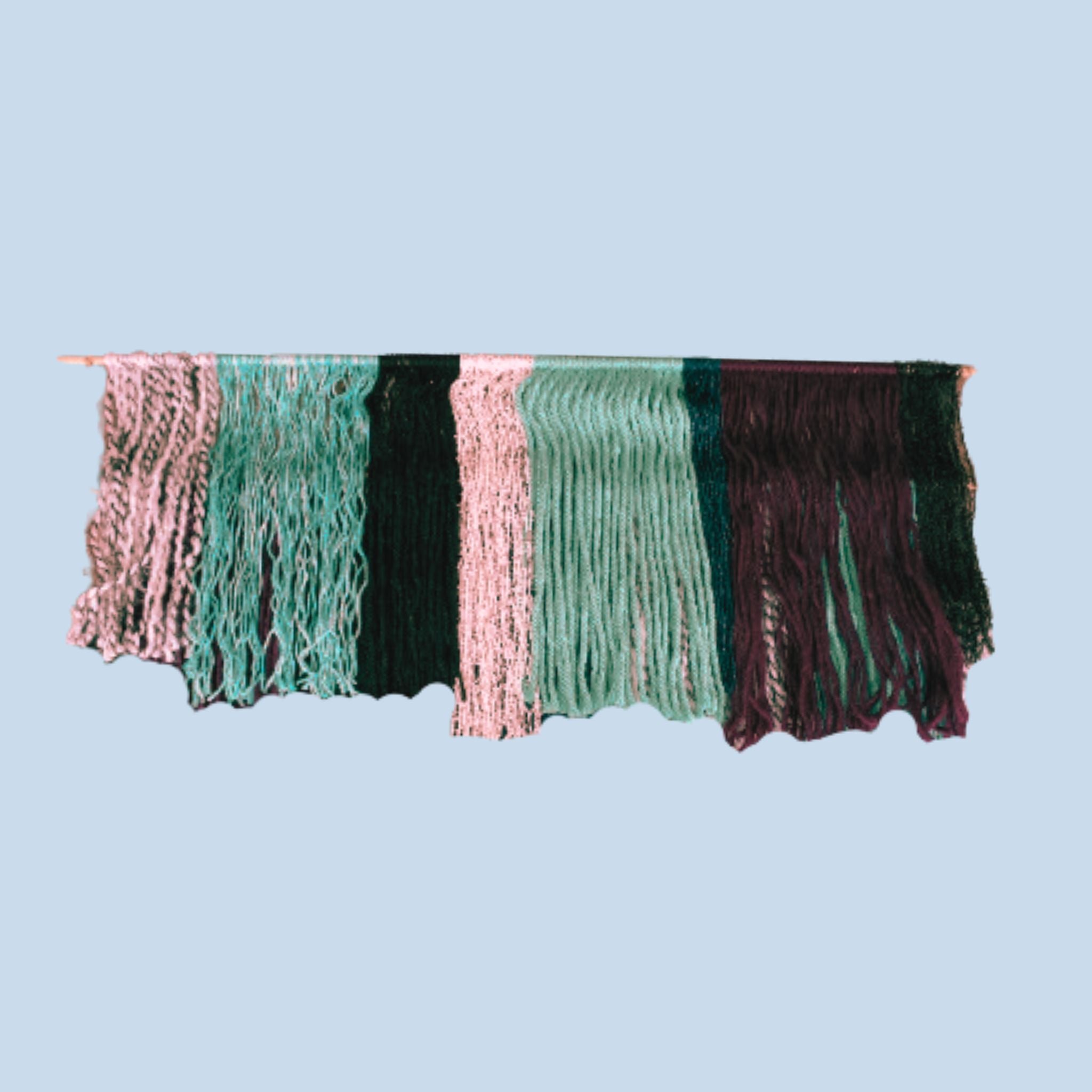 colorful  tiered yarn wall hanging