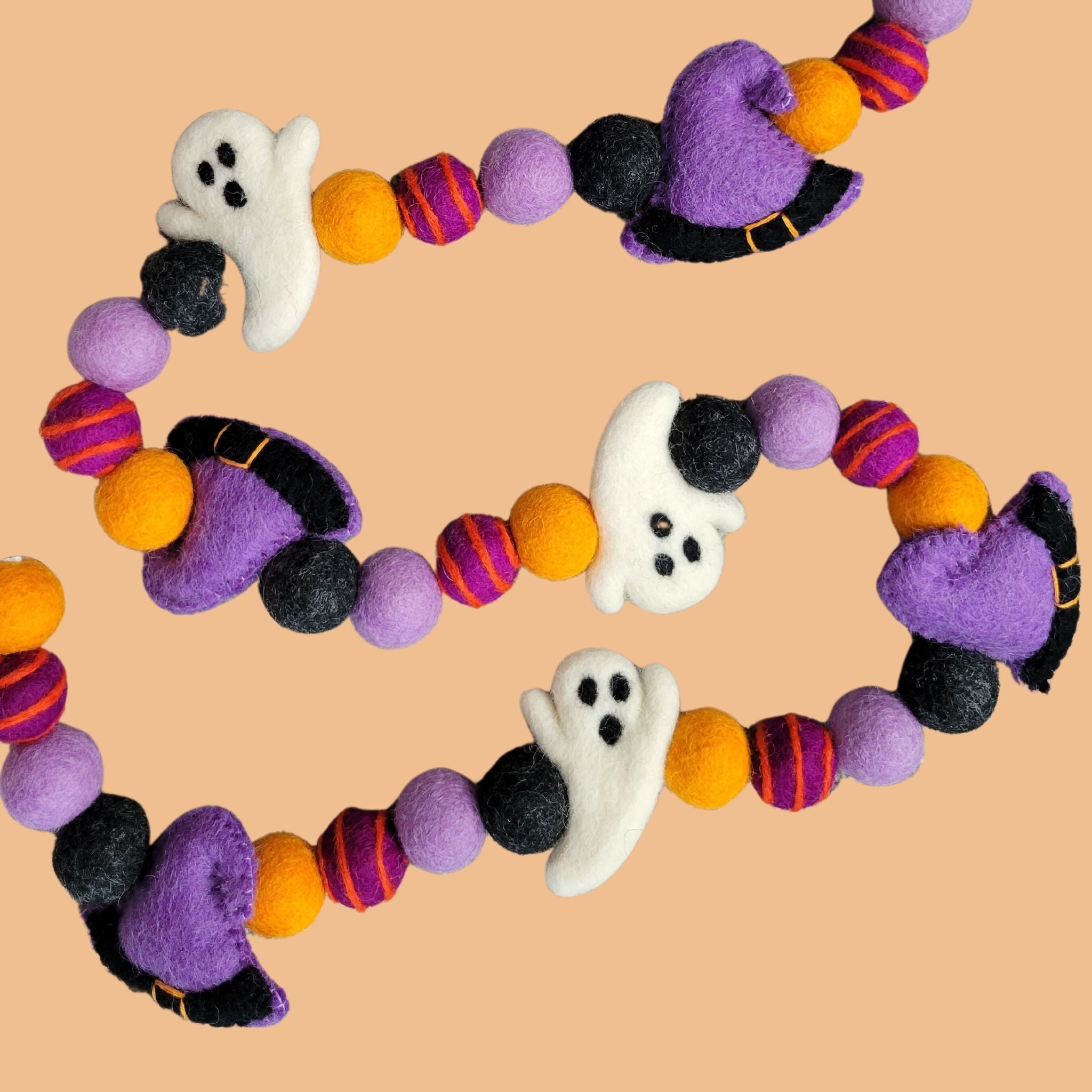 halloween garland with hand-crafted felt ghosts and witch hats