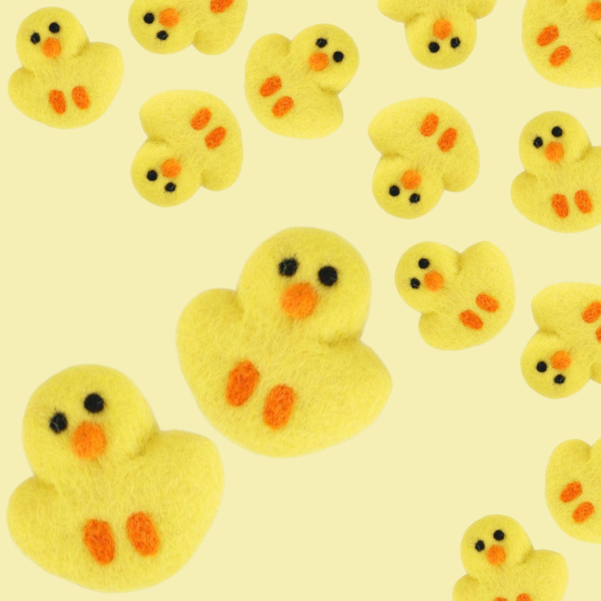 felt pieces that look like chicks or ducks